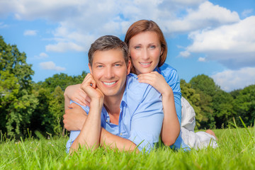 smiling lying green couple