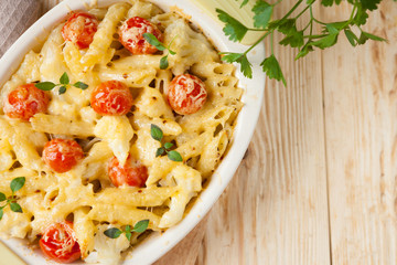 penne pasta under a cheese crust