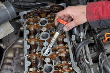 Mechanic replace ignition coil on car gasoline engine