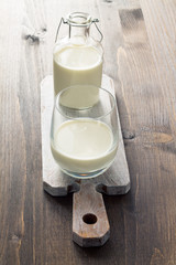 Milk on wooden background
