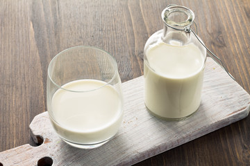 Milk on wooden background