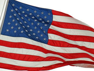 Fototapeta premium American Flag Flying Proudly in the Wind