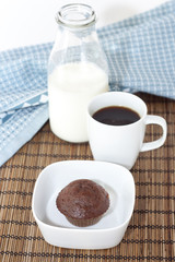 Muffin on the plate with coffe and milk