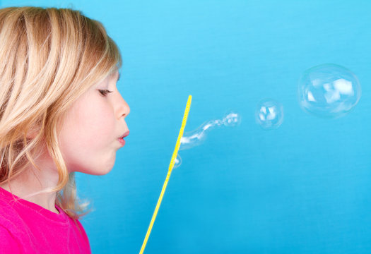 Child Blowing Bubbles