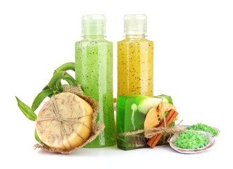 Bottles with scrub and hand-made soap, isolated on white