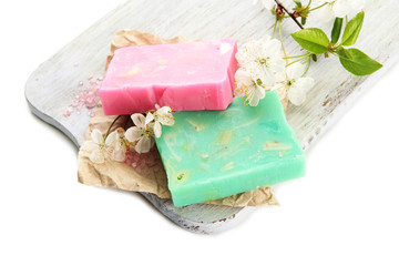 Natural handmade soap on wooden desk, isolated on white
