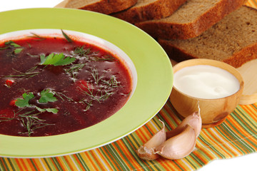Delicious borsch on table close-up
