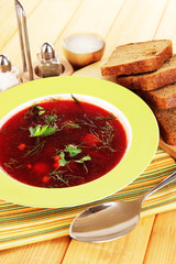 Delicious borsch on table close-up