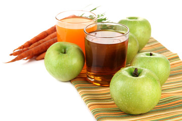 Glasses of juice, apples and carrots, isolated on white