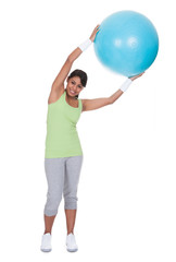 Young Woman Exercising With Pilates Ball