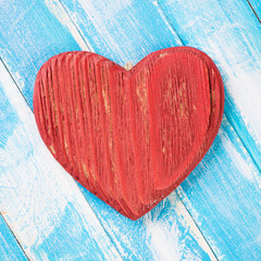 Red wooden heart on wooden boards, view from above