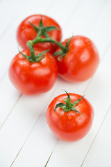 Vegetables: red tomatoes, vertical shot