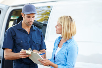 Customer Signing For Delivery From Courier
