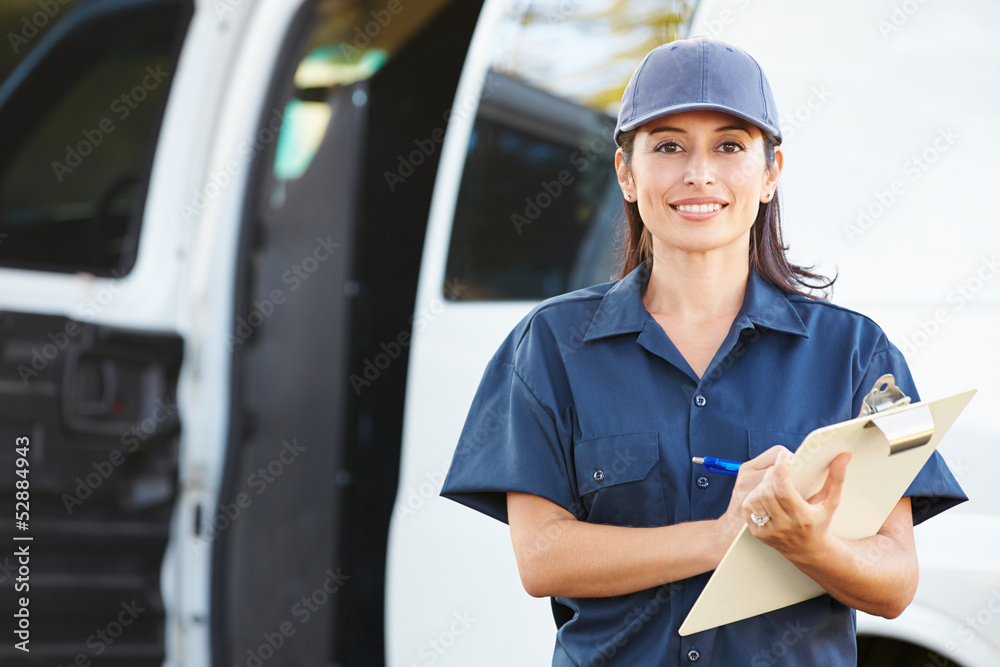 Wall mural Portrait Of Female Delivery Driver With Clipboard