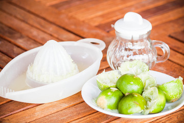 After squashed fresh citrus lime on wood table