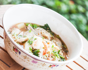 Thai noodles  with pork and shrimp in spicy soup