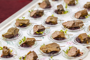 dolmades / stuffed vineleaves with deer and red chutney