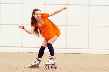 girl  rollerblading in street city