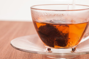 Hot tea in the making close up