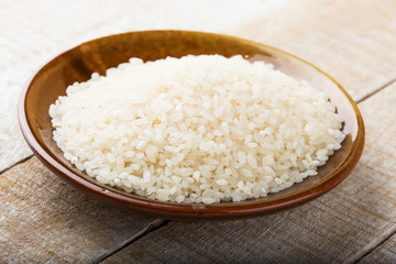 Fototapeta na wymiar Rice in ceramic bowl