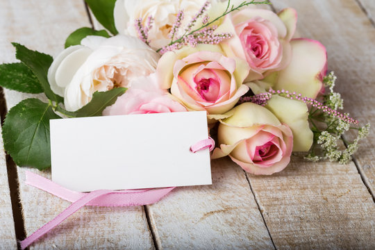Postcard with elegant  flowers and empty tag for your text