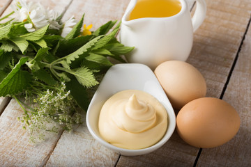 Mayonnaise in bowl on table