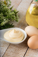Mayonnaise in bowl on table