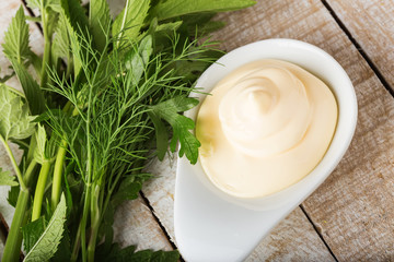 Mayonnaise in bowl on table