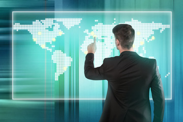 Businessman pressing location on a world map screen