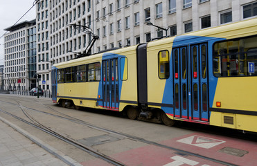 Naklejka na ściany i meble Modern fast tram in the urban landscape