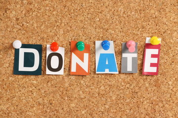 The word Donate on a Cork Notice Board