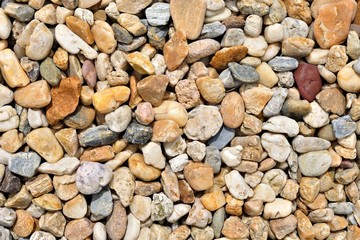 Background of colorful beach pebbles of different shape and size