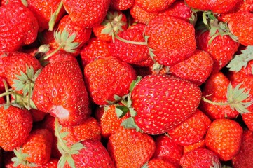 Texture from group of red ripe strawberries