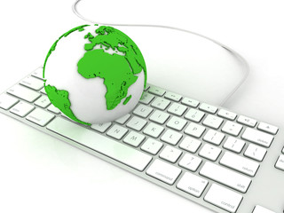 Earth globe over keyboards computer