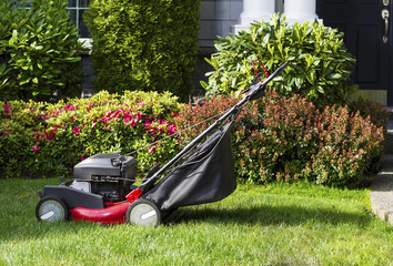 Old Lawnmower on Front Yard Ready for Work
