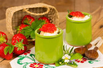 Fresh picked strawberries for healthy breakfast with a cottage c