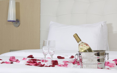 hotel room with big bed and red flowers