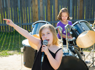 chidren singer girl singing playing live band in backyard
