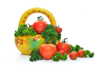 Fresh tomatoes and parsley in basket, isolated on white