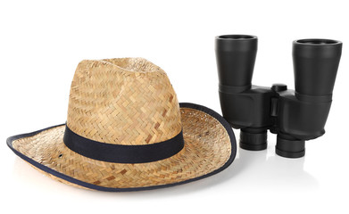 Black modern binoculars with straw hat isolated on white