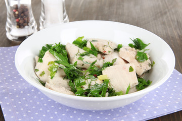 Boiled meat on plate on napkin close-up