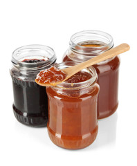 Tasty jam in banks isolated on white