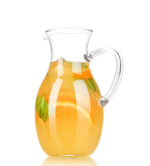 Orange lemonade in pitcher isolated on white