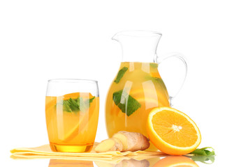 Orange lemonade in pitcher and glass isolated on white