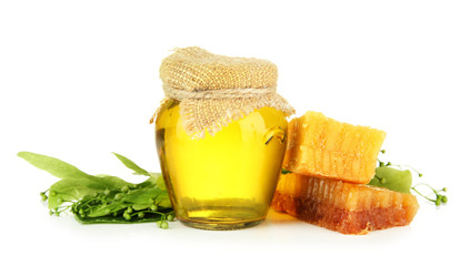 Jar of honey, honeycombs with flowers of lime, isolated on