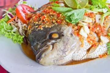 Freshwater fish(Giant gourami) steamed with lemon and sauce.