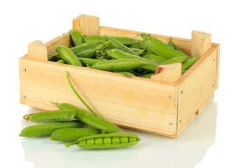 Sweet green peas in wooden box isolated on white