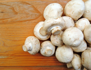 Fresh mushrooms on a wooden board