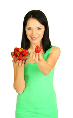 Beautiful young woman with strawberries on grey background