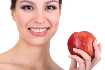 Smiling woman with apple isolated on white